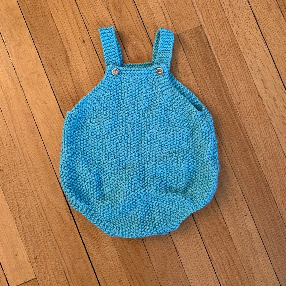 Pale blue hand knit bubble romper for baby